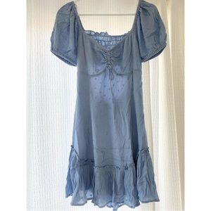 Light blue Ruffle dress with cut out back. Size Medium. With tags.